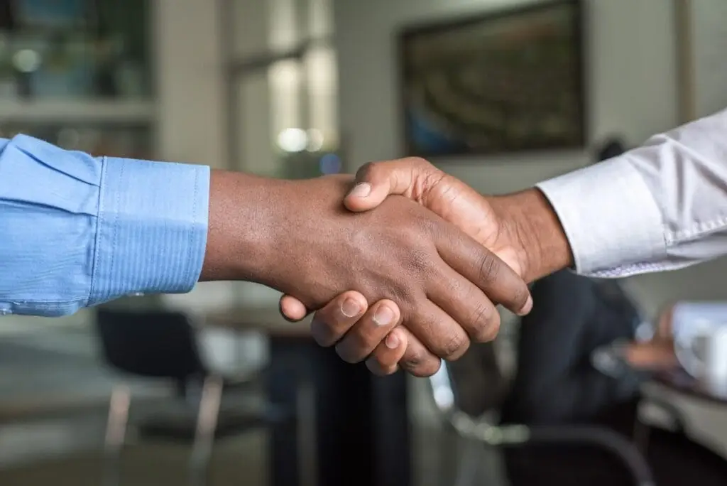 Business handshake representing trust and governance